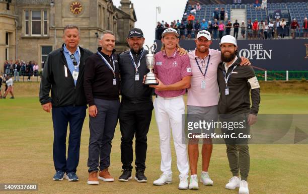 Cameron Smith of Australia poses for a photograph alongside caddie Sam Pinfold and team as he celebrates with The Claret Jug during Day Four of The...