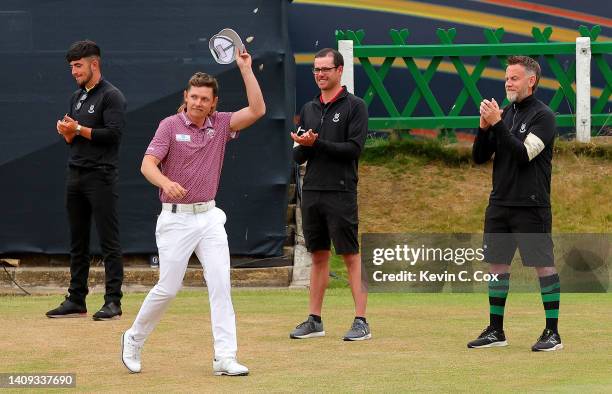Cameron Smith of Australia acknowledges the crowd as he walks on the 18th green during the prize giving ceremony during Day Four of The 150th Open at...