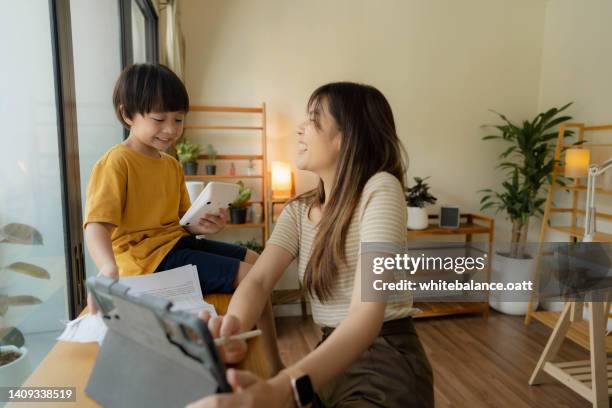 mother planning home budget for save cost. - financial planner stockfoto's en -beelden