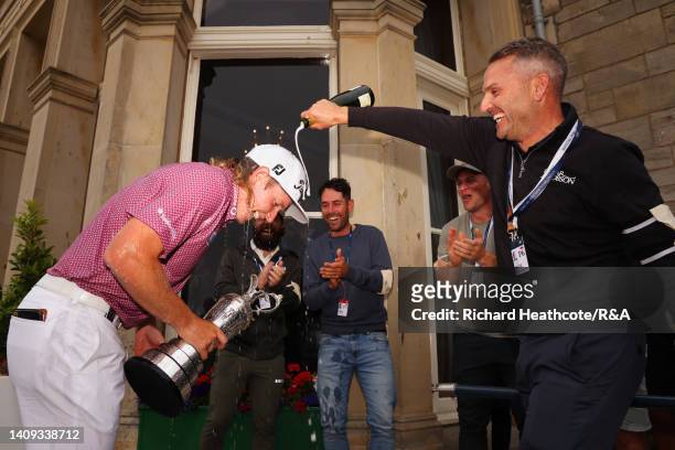 Cameron Smith of Australia celebrates outside the R&A Clubhouse following victory on Day Four of The 150th Open at St Andrews Old Course on July 17,...