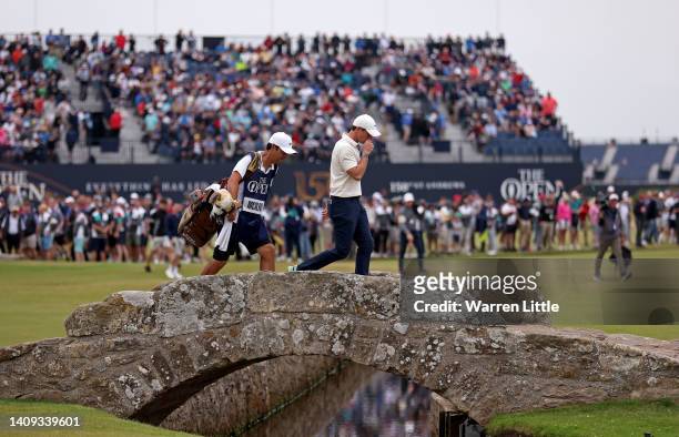 Rory McIlroy of Northern Ireland looks dejected as he crosses the Swilcan Bridge on the 18th hole during Day Four of The 150th Open at St Andrews Old...