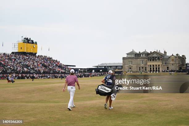 Cameron Smith of Australia and his caddie walk on the eighteenth fairway during Day Four of The 150th Open at St Andrews Old Course on July 17, 2022...