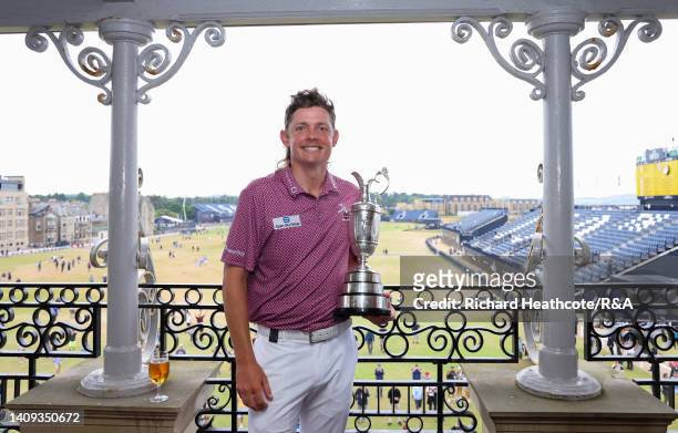 Cameron Smith of Australia poses with The Claret Jug on the balcony of the R&A Clubhouse following victory on Day Four of The 150th Open at St...