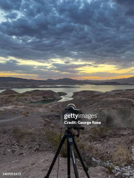 Sunrise and clouds over Lake Mead, the country's largest man-made water reservoir, formed by Hoover Dam on the Colorado River in the Southwestern...