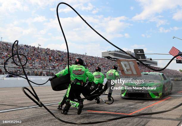 The pit crew of the Interstate Batteries Toyota, driven by Martin Truex Jr. Leap into action during the NASCAR Cup Series Ambetter 301 at New...