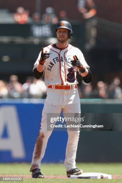 Austin Slater of the San Francisco Giants reacts after hitting a double in the bottom of the first inning against the Milwaukee Brewers at Oracle...