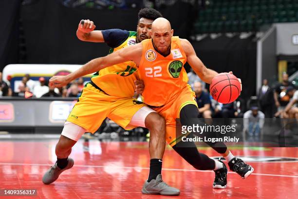 Adam Drexler of the Aliens drives toward the hoop against Leandro Barbosa of the Ball Hogs during the game in BIG3 Week 5 at Comerica Center on July...