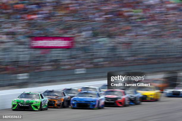 Martin Truex Jr., driver of the Interstate Batteries Toyota, leads the field during the NASCAR Cup Series Ambetter 301 at New Hampshire Motor...