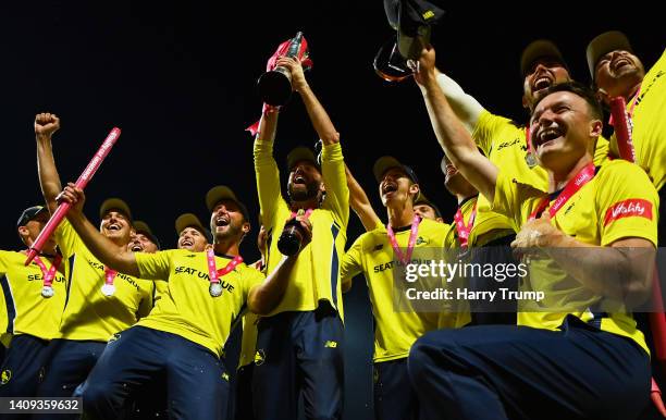 James Vince of Hampshire Hawks lfits the Vitality Blast Trophy alongside their team mates following the Vitality Blast Final match between Lancashire...