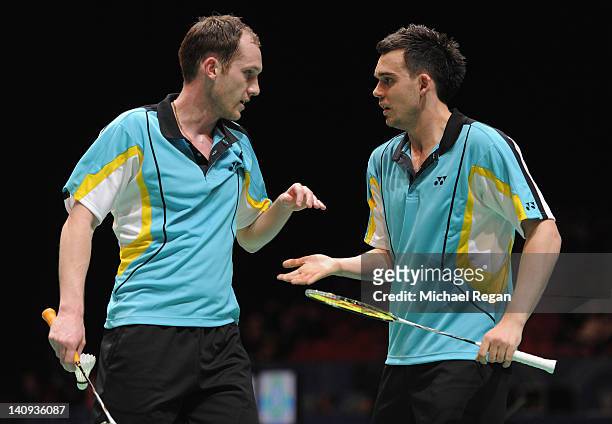 Chris Adcock of England speaks to partner Andrew Ellis of England during their mens doubles match against Jung Jae Sung and Lee Yong Dae of Korea...
