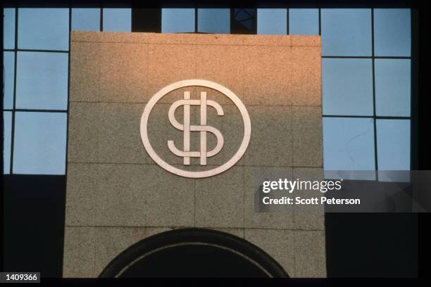 Modern building displays a dollar sign December 20, 1996 in Abu Dhabi, United Arab Emirates. Since the 1960s the UAE has progressed from a largely...