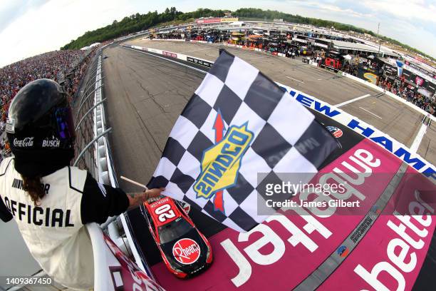 Christopher Bell, driver of the Rheem/WATTS Toyota, takes the checkered flag to win the NASCAR Cup Series Ambetter 301 at New Hampshire Motor...