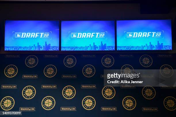 General view of the MLB Draft '22 logo on the TV monitors in the Seattle Mariners interview room before the MLB Draft at T-Mobile Park on July 17,...