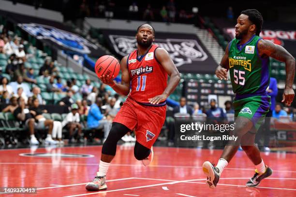 Jeremy Pargo of the Triplets looks to shoot against Kevin Murphy of the 3 Headed Monsters during the game in BIG3 Week 5 at Comerica Center on July...