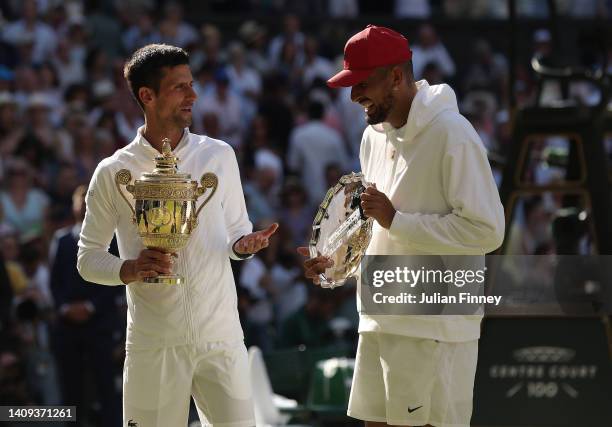 Winner Novak Djokovic of Serbia and runner up Nick Kyrgios of Australia pose for a photo with their trophies following their Men's Singles Final...