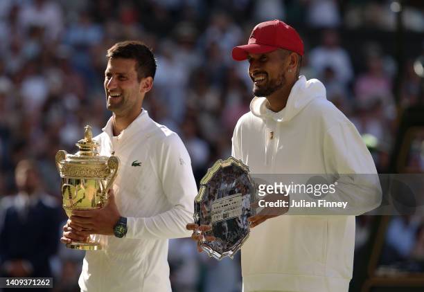 Winner Novak Djokovic of Serbia and runner up Nick Kyrgios of Australia pose for a photo with their trophies following their Men's Singles Final...