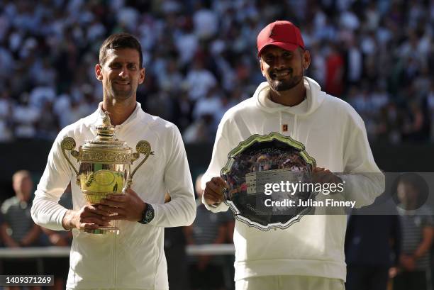 Winner Novak Djokovic of Serbia and runner up Nick Kyrgios of Australia pose for a photo with their trophies following their Men's Singles Final...