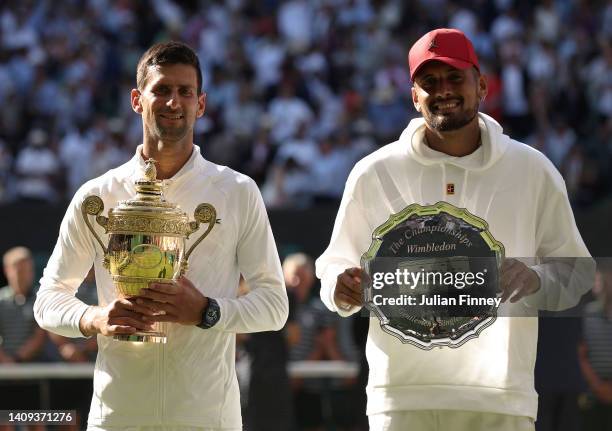 Winner Novak Djokovic of Serbia and runner up Nick Kyrgios of Australia pose for a photo with their trophies following their Men's Singles Final...