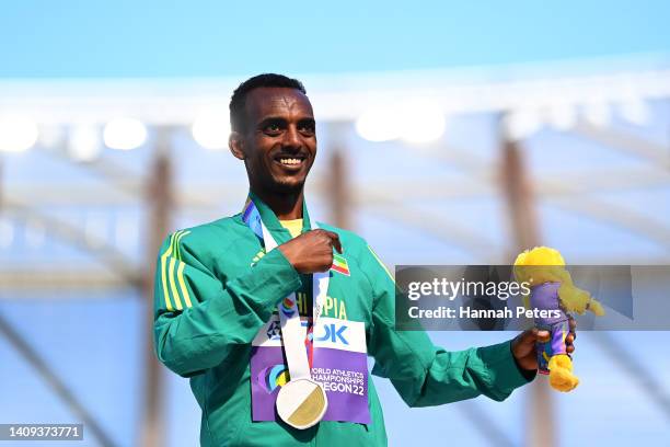 Gold medalist Tamirat Tola of Team Ethiopia celebrates during the medal ceremony for the Men's Marathon on day three of the World Athletics...