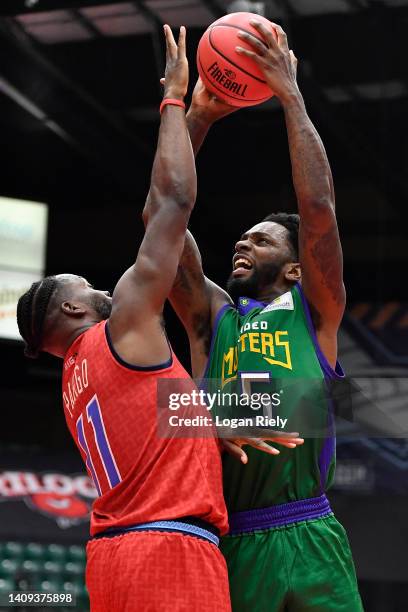 Jeremy Pargo of the Triplets defends against the shot by Quincy Miller of the 3 Headed Monsters during the game in BIG3 Week 5 at Comerica Center on...