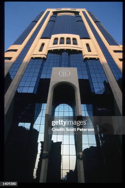 Modern building displays a dollar sign December 20, 1996 in Abu Dhabi, United Arab Emirates. Since the 1960s the UAE has progressed from a largely...