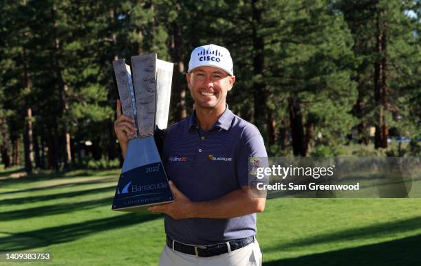 Chez Reavie of the United States poses with the trophy after putting in to win on the 18th green during the final round of the Barracuda Championship...