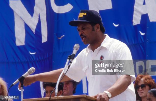 McFARLAND, CALIFORNIA Presidential candidate Rev. Jesse Jackson speaks to the crowd after joining United Farm Workers President Cesar Chavez in a...