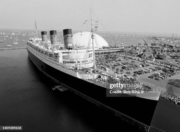 View of RMS Queen Mary and Worlds Largest Geodesic Dome during Tall Ship Parade, July 6, 1984 in Long Beach, California.