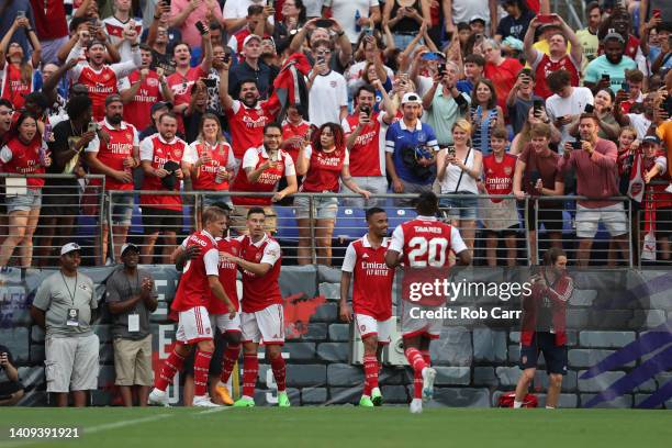 Members of Arsenal celebrate a first half goal against Everton during a preseason friendly at M&T Bank Stadium on July 16, 2022 in Baltimore,...