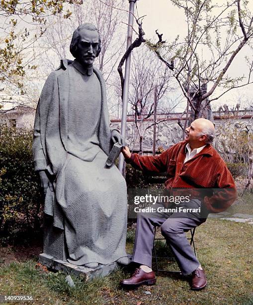 The Spanish sculptor Juan Avalos in the garden of his studio with some of his works Madrid, Spain.