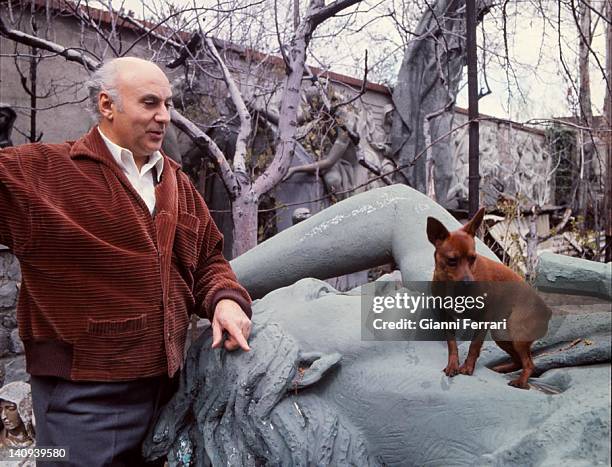 The Spanish sculptor Juan Avalos in the garden of his studio with some of his works Madrid, Spain.