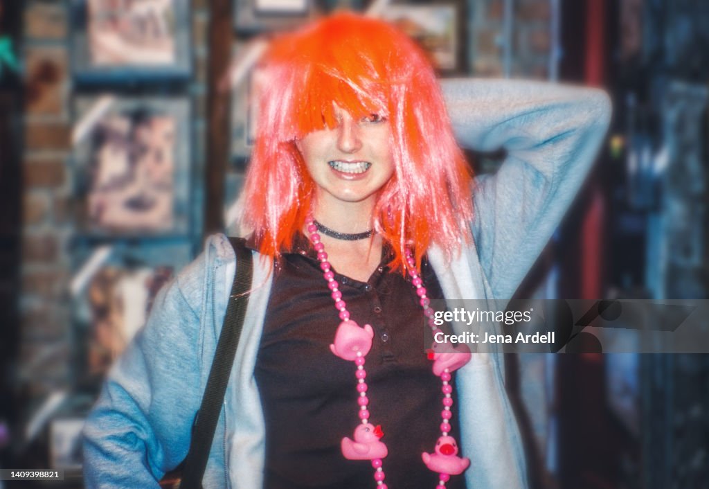Funny Woman Wearing Wig and Mardi Gras Beads