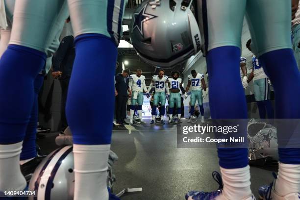 Darian Thompson of the Dallas Cowboys huddles up with teammates against the Washington Football Team during an NFL game at AT&T Stadium on December...