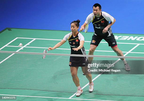 Huan Xia and Tang Jinhua of China in action during their mixed doubles match against Cheng Wen Hsing and Chien Yu Chin of Chinese Taipei during the...