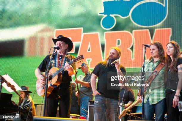 Willie Nelson, Jamey Johnson, Lukas Nelson and girlfriend on stage at the Farm Aid Concert at the Livestrong Sporting Park in Kansas City, Kansas on...