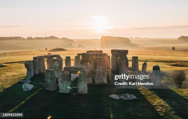 an aerial view of stonehenge at sunrise - paganism stock pictures, royalty-free photos & images