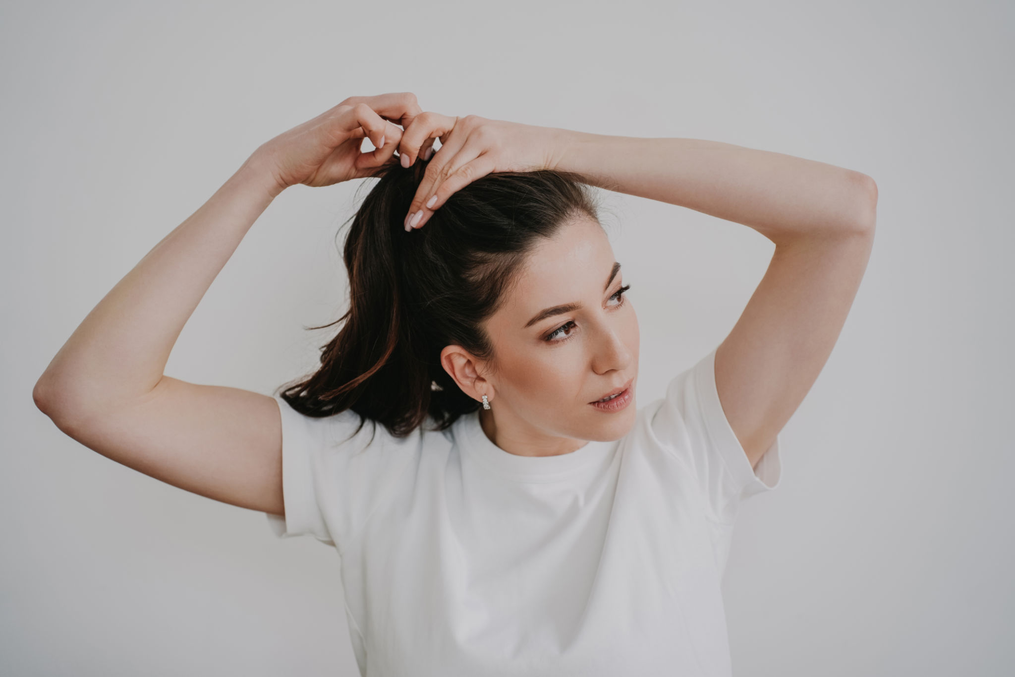 woman styling her hair