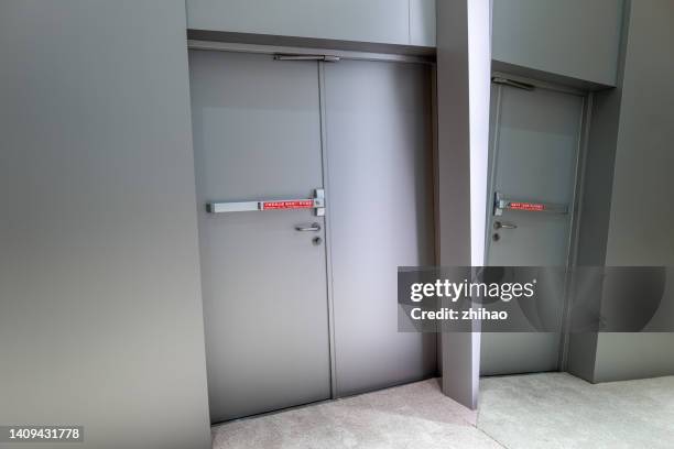 mirror reflection fire door - emergency exit light stock pictures, royalty-free photos & images