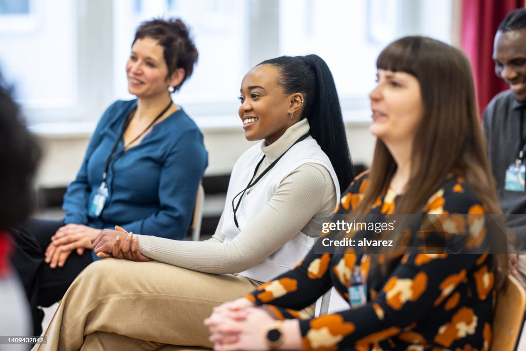 Group of businesswomen sitting attentively in a seminar