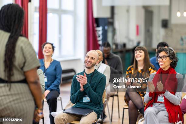 businesspeople applauding good presentation in office - participant stock pictures, royalty-free photos & images