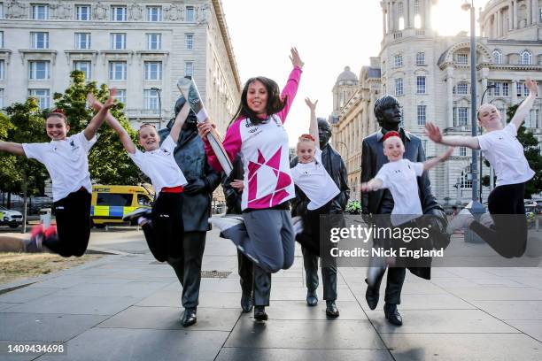 Batonbearer Beth Tweddle MBE holds the Queen's Baton as it visits Liverpool as part of the Birmingham 2022 Queen's Baton Relay on July 18, 2022 at...