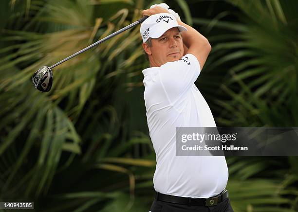 Fredrik Jacobson of Sweden watches his tee shot on the eighth hole during first round of the World Golf Championships-Cadillac Championship on the...