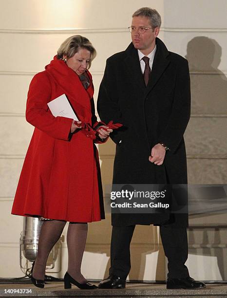 German Environment Minister Norbert Roettgen and his wife Ebba Herfs-Roettgen attend the Zapfenstreich, or taps, farewell ceremony for former German...