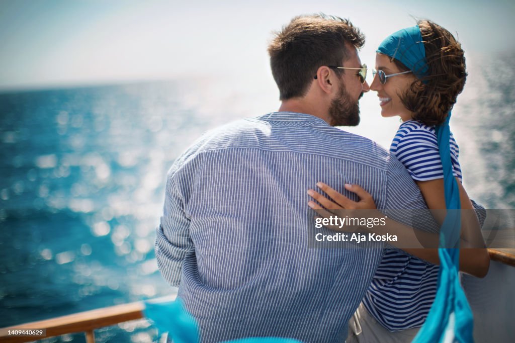 Young couple on a sailing cruise.