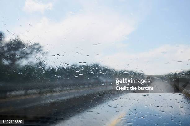 rain drops on windshield - raindrop stock pictures, royalty-free photos & images