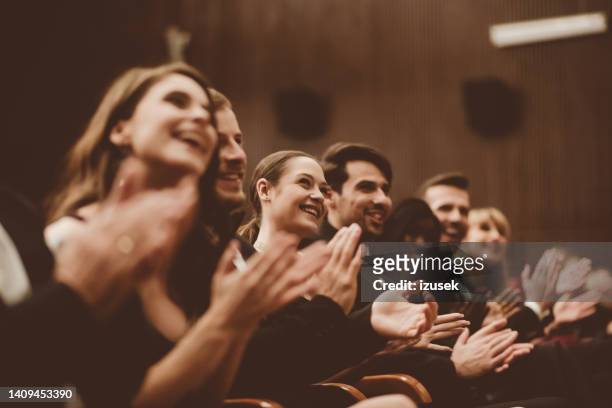 excited audience clapping in the theater - gala dinner stock pictures, royalty-free photos & images