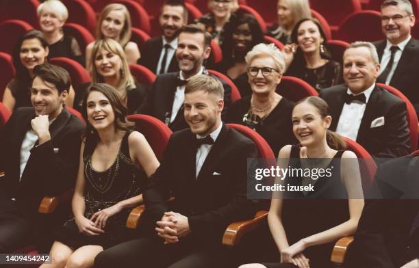 happy audience sitting in opera house - gala reception stock pictures, royalty-free photos & images