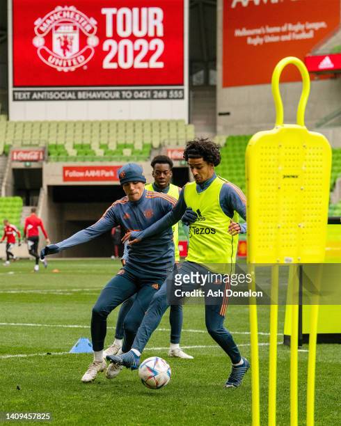 Zidane Iqbal and Alejandro Garnacho of Manchester United in action during a Manchester United pre-season training session at AAMI Park on July 18,...