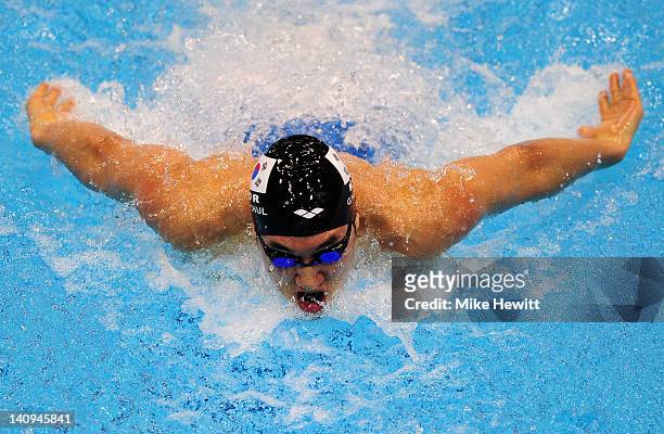 Gyucheol Chang of Korea competes in the Men's 100m Butterfly Guest Final during day six of the British Gas Swimming Championships at The London...