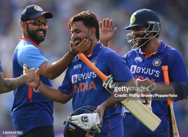 Rishabh Pant is congratulated by Rohit Sharma after India won the third ODI between England and India at Emirates Old Trafford on July 17, 2022 in...